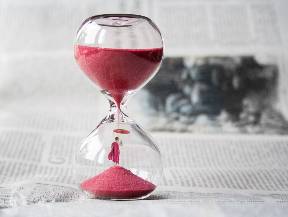 Hourglass on Journal Paper